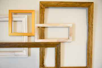 Wooden frames randomly arranged on a light background