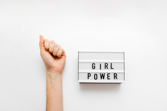 Girl power text on the lightbox. Top view. White background
