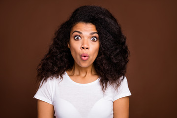 Close up photo of astonished afro american girl hear news wonder stare stupor wear casual style outfit isolated over brown color background