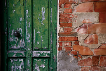 old wooden door and red bricks