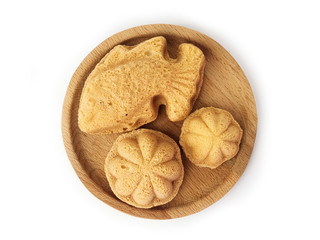 Traditional baulu cakes in Malaysia are called kuih bahulu in the form of goldfish and star gooseberry.