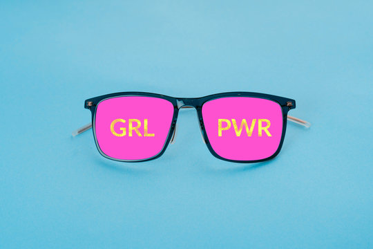 Pink glasses on blue background. Minimal concept of summer vacation
