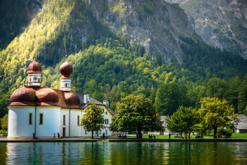 Bavarian mountain landscape with lake and church