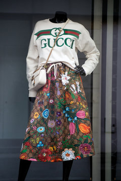 Mulhouse - France - 26 January 2020 - Closeup of printed colorful  skirt and pullover by Gucci on mannequin in a luxury fashion store showroom