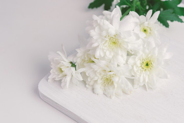 white flower on wood background