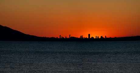 Sunset over Benidorm city skyline and sea in Alicante