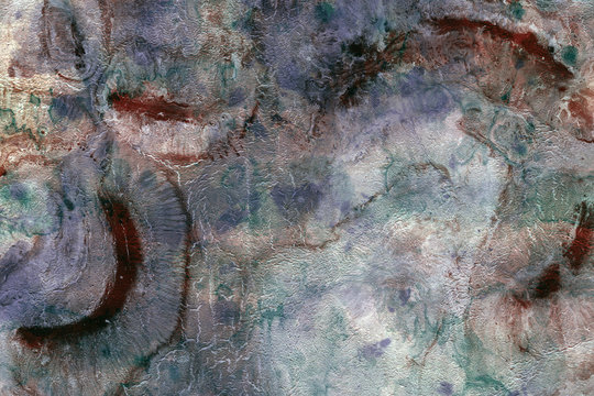 Prehistoric, textured multicolored background. Abstract naturalism with rough surface. Geologic or fossil theme. 