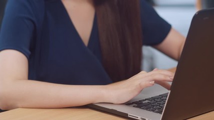 Successful beautiful executive Asia young businesswoman smart casual wear watching tutorial about creative ideas at laptop computer during working process in modern office workplace. Close up shot. - Powered by Adobe