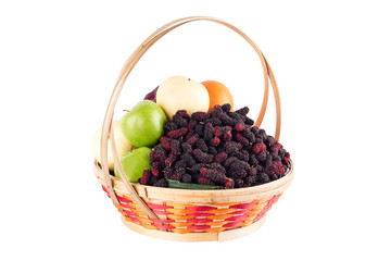 fresh orange, Chinese pear, green apple and mulberry in bamboo wicker basket on white background fruit health food isolated