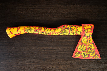 .axe in Khokhloma. An axe painted in Russian folk style. Russian traditions