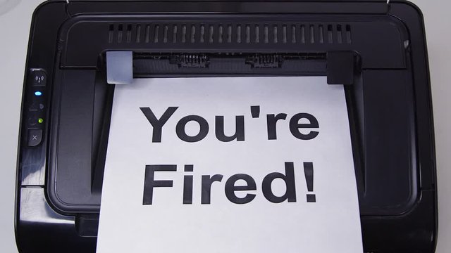 Close up getting Print of You're Fired on Paper from Printer 
