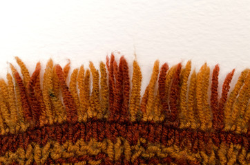 Colored hand knitting scarf. Texture. Close-up.