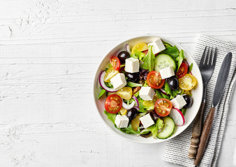 Greek salad with fresh vegetables, feta cheese and black olives