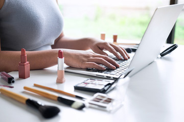 Business online on social media, Beautiful woman is watching online blogger tutorial on laptop,...