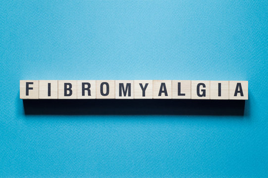 Fibromyalgia word concept on cubes