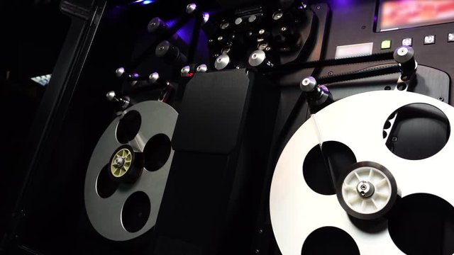 The machine is scanning 35 mm film to digital, Film scanner.