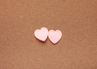 Cork board with heart stickers. Valentine's Day concept.
