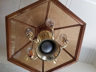 Low Angle View Of Electric Lamp On Ceiling At Home