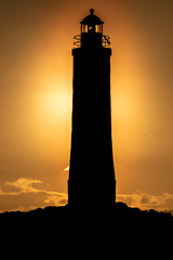 Sunset over the Eclaireurs Lighthouse (the Scouts) a lighthouse standing on the northeastern-most island in the Beagle Channel, near Ushuaia, Tierra del Fuego, Argentina.