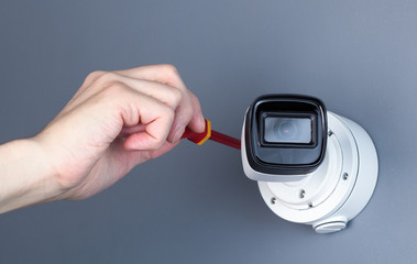 Technician installing CCTV camera video security