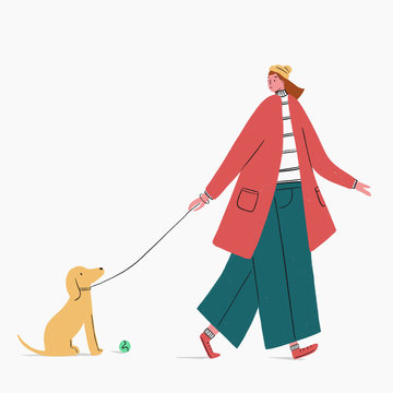 Woman walking dog with ball