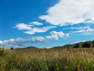 September landscape with beautiful cloudy sky and the Bulgarian Fore-Balkan mountain hills
