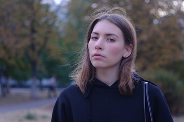 Young woman alone in an old city street