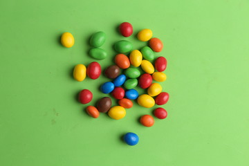 Obraz premium delicious colorful chocolate balls stuffed with peanut