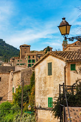 Fototapeta na wymiar Street of Valldemossa old mediterranean village, landmark of Majorca, Spain island