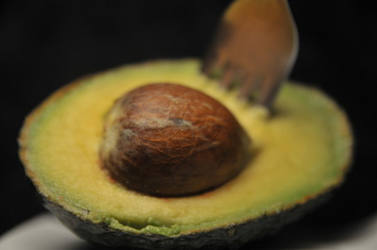 avocado on black background