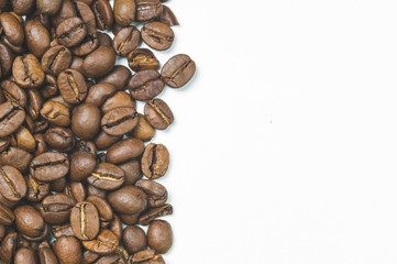 roasted coffee beans on a white background top view, space for text on the right