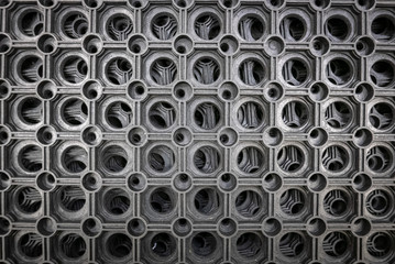Perforated metal pattern background. Black and gray metal background.