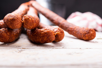 Kabanos. Long, thin, dry smoked pork sausage.