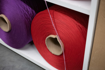 Cotton sewing threaded reels in a sewing shop