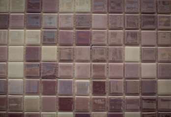 Purple ceramic mosaic on the wall as background