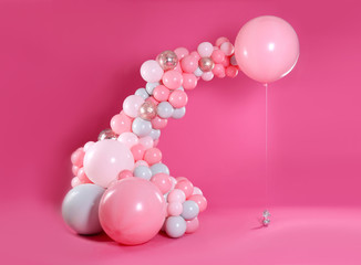 Beautiful composition with balloons on pink background