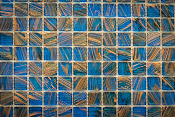 Fototapeta premium Brown and blue ceramic mosaic on the wall as background