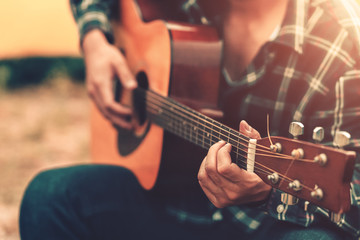 Obraz na płótnie Canvas Close up of man hand playing guitar.