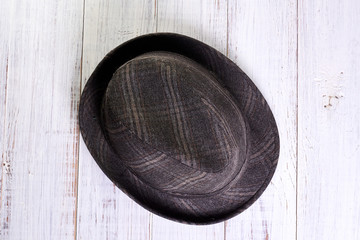 Gray hat on a light wooden background