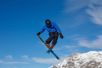 Freestyle ski jumper with crossed skis