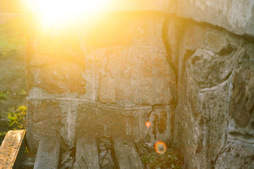 wall of stone. sunlight.