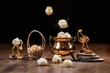 Funny scene with popcorn figures on a wooden table