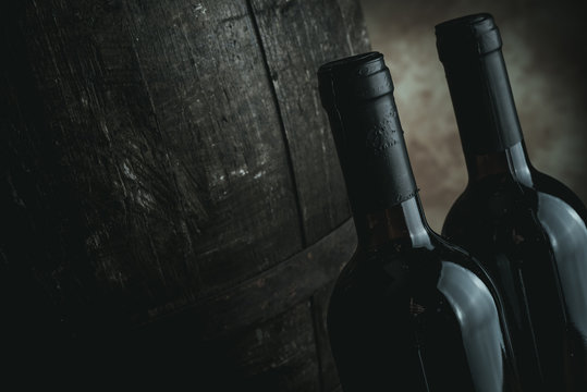 red wine bottles and barrel - desaturated style image