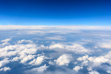 High blue sky and various shapes of white clouds