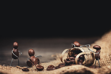 miniature coffee bean figures are sitting or standing around a basket