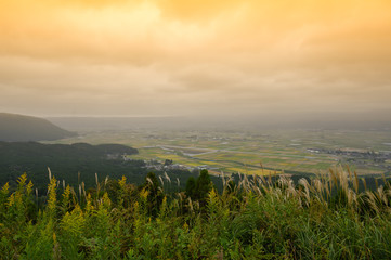 Fototapeta na wymiar Spacious rural scenery on top of the mountain in Aso Japan.Viewpoint of Aso in japan.