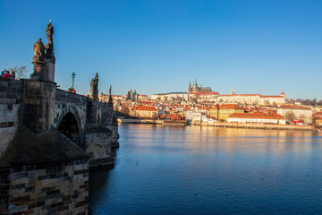 Fototapeta na wymiar Bridge, river Vltava and Prague castle