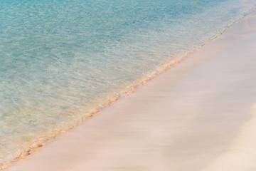 Fototapeta na wymiar Pink beach with transparent water in Greece. Elafonissi beach, Crete Greece