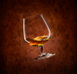 Swirling glass on wood background