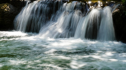 Fototapeta premium Green waterfall (Chet Sao Noi waterfall) in Thailand.